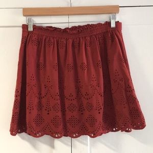 Red skirt with eyelet pattern